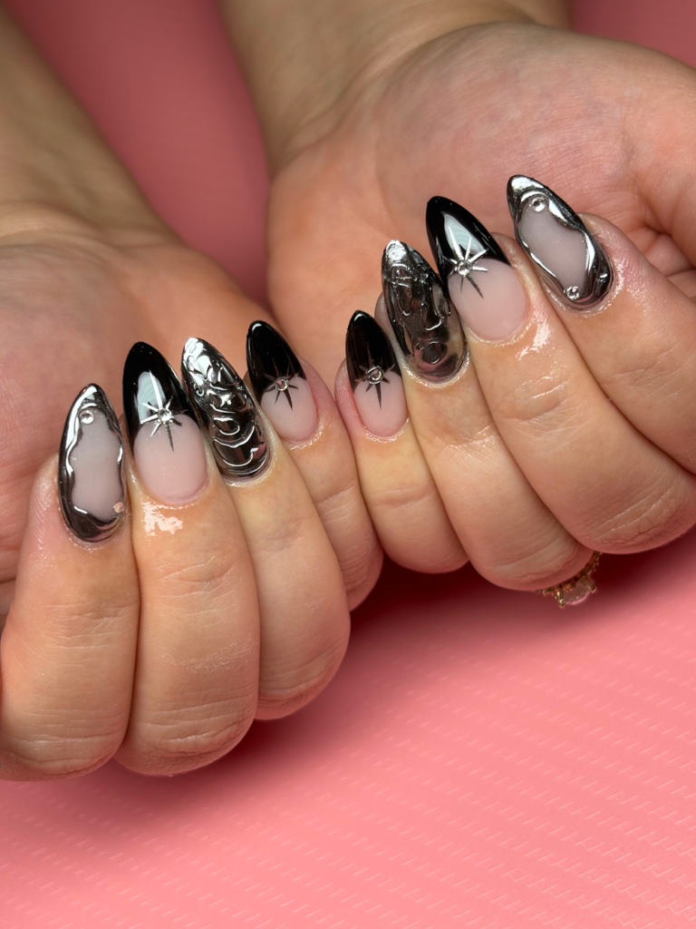 Black and chrome french tip Gel-X nails.